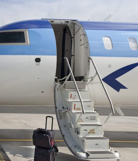 blue-and-white-airplane-with-luggage-on-tarmac-2026-03-25-07-00-24-utc (1) (1)